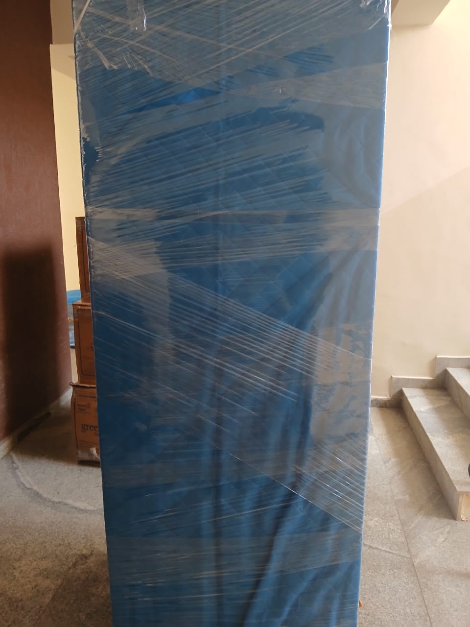 City house shifting tall wrapped furniture